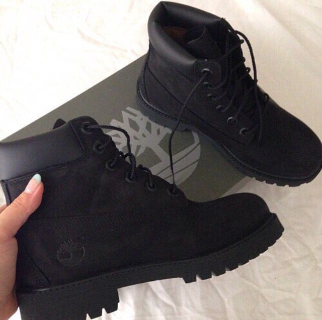 all black timberlands on feet
