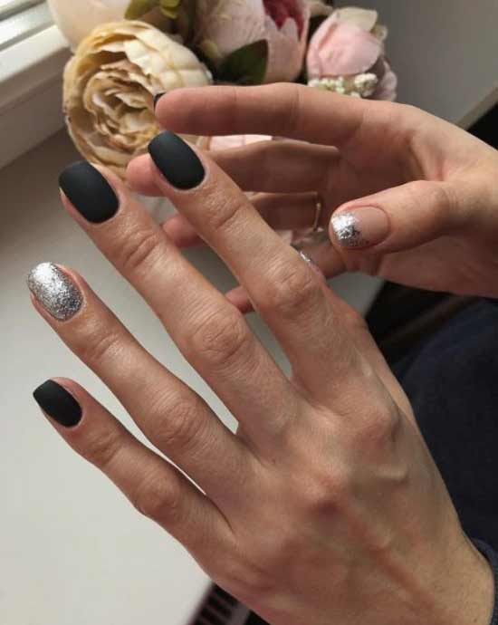Black glitter manicure on the ring finger