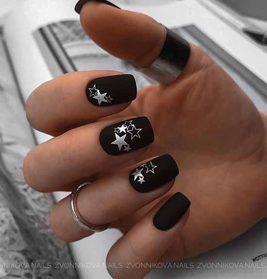 Matte black manicure with shiny stars