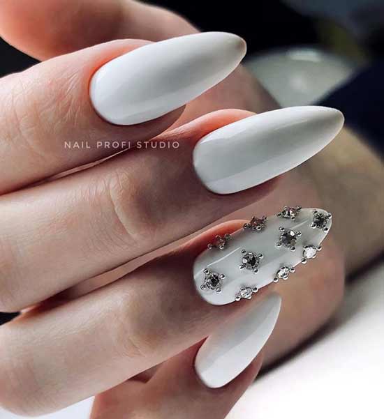 White manicure with rhinestones