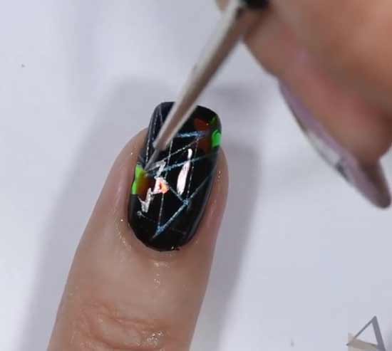 Spider web nail design with stickers and foil