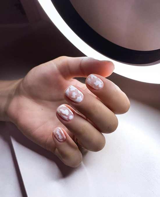 White manicure with clouds