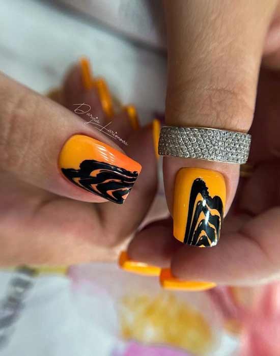 Orange yellow manicure with black print