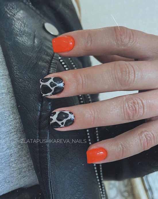 Orange with black print manicure