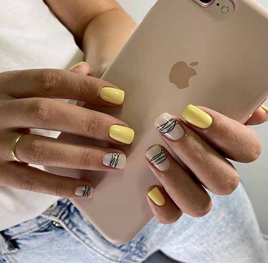 Yellow nail design with spiderweb
