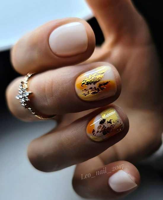 Yellow manicure with gold foil 