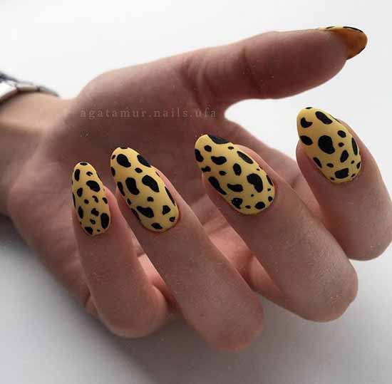 Yellow manicure with black print