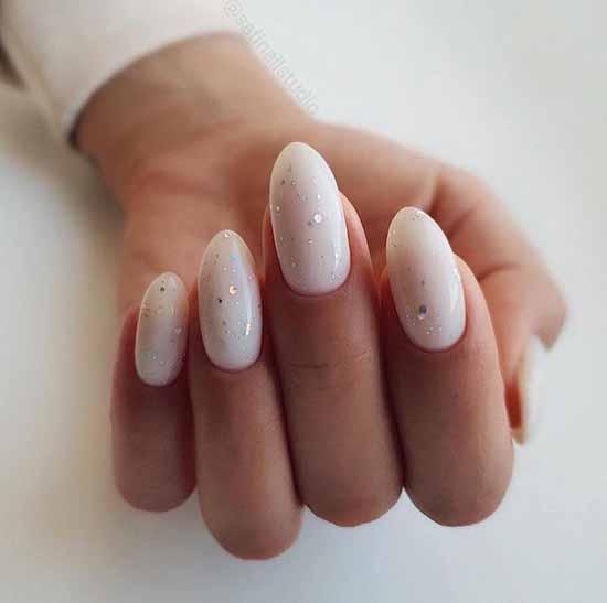 Delicate milky glitter manicure