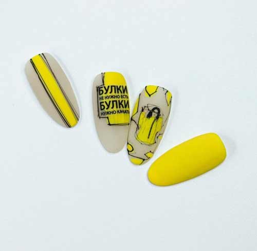 Bright manicure with inscriptions