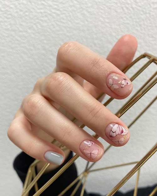 Delicate manicure with butterflies