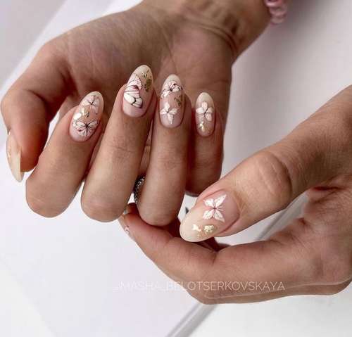Delicate manicure with butterflies