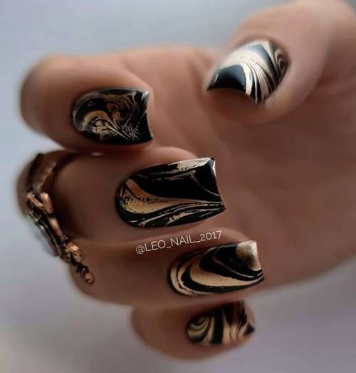 Black manicure with gold